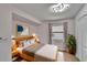 Bedroom featuring a full bed and stylish decor at 322 Northway Dr, Sun City Center, FL 33573
