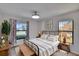 Bright bedroom with lots of windows and a wooden bench at 322 Northway Dr, Sun City Center, FL 33573