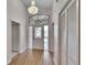 Elegant foyer showcasing beautiful floors, chandelier, and a front door with sidelights at 322 Northway Dr, Sun City Center, FL 33573