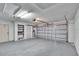 Spacious garage with ample storage shelving and a fully functional garage door at 322 Northway Dr, Sun City Center, FL 33573
