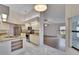 Open kitchen with modern appliances flows into the living area with wood flooring at 322 Northway Dr, Sun City Center, FL 33573