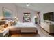Comfortable main bedroom with a large window, fan, and stylish decor at 322 Northway Dr, Sun City Center, FL 33573