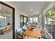 Inviting sunroom featuring stylish furniture, bright windows, and tranquil outdoor views at 322 Northway Dr, Sun City Center, FL 33573