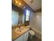 Bathroom featuring a white vanity, framed mirror, and a shower/tub combo at 3441 Santa Rita Lane, Land O Lakes, FL 34639