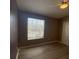 Bedroom featuring hardwood flooring, ceiling fan, and window providing natural light at 3441 Santa Rita Lane, Land O Lakes, FL 34639