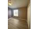 Bedroom featuring hardwood flooring, ceiling fan, window, and closet at 3441 Santa Rita Lane, Land O Lakes, FL 34639