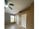 Bedroom view featuring a vaulted ceiling, ceiling fan, and two closets at 3441 Santa Rita Lane, Land O Lakes, FL 34639