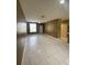 A living room is brightly lit with tile floors, ceiling fan, and access to the kitchen at 3441 Santa Rita Lane, Land O Lakes, FL 34639