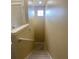 View of the stairs going down with wood look floors and a small window at 3441 Santa Rita Lane, Land O Lakes, FL 34639