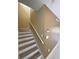 Stairway featuring wood-look stairs, white risers, and white banister at 3441 Santa Rita Lane, Land O Lakes, FL 34639