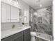 Beautiful bathroom featuring a marble shower, modern fixtures, and stylish vanity at 3945 Versailles Dr, Tampa, FL 33634