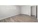 Light-filled bedroom featuring wood-look floors, white trim, window with shutters, and closet at 3945 Versailles Dr, Tampa, FL 33634