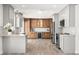 Modern kitchen boasts two-tone cabinets, stainless steel appliances, and stone countertops at 3945 Versailles Dr, Tampa, FL 33634