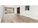 Open floor plan with wood-look tile and natural light at 3945 Versailles Dr, Tampa, FL 33634