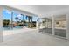 Covered patio with views of the pool and canal provides the ideal space for outdoor entertaining at 3945 Versailles Dr, Tampa, FL 33634