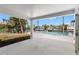 Covered patio with waterfront views of the pool provides the ideal space for outdoor relaxation at 3945 Versailles Dr, Tampa, FL 33634