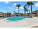 Waterfront pool with mature palms offers a private oasis for relaxation and recreation at 3945 Versailles Dr, Tampa, FL 33634