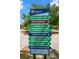 Community signage offering directions to various amenities: Tennis/Pickleball, Athletics, Trailhead, etc at 3945 Versailles Dr, Tampa, FL 33634