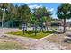 Outdoor workout area features modern exercise equipment and padded flooring, promoting an active lifestyle at 3945 Versailles Dr, Tampa, FL 33634