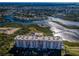 A high-rise condo overlooks a scenic river, offering breathtaking views of the waterfront community at 4516 Seagull Dr # 615, New Port Richey, FL 34652