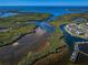 Beautiful aerial view of the complex on the water near houses with boat docks at 4516 Seagull Dr # 615, New Port Richey, FL 34652