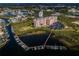 Aerial view of waterfront condo near boat dock and residential area at 4516 Seagull Dr # 615, New Port Richey, FL 34652