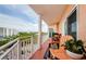Enjoy beautiful views from this balcony featuring outdoor seating and white railings at 4516 Seagull Dr # 615, New Port Richey, FL 34652
