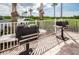 This grilling area features two propane grills, surrounded by palm trees and parking at 4516 Seagull Dr # 615, New Port Richey, FL 34652