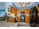 Well-equipped kitchen featuring granite countertops, stainless steel appliances, and wood cabinets at 4516 Seagull Dr # 615, New Port Richey, FL 34652
