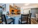 Kitchen features granite countertops, wooden cabinets, stainless steel appliances, and breakfast bar at 4516 Seagull Dr # 615, New Port Richey, FL 34652