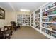This library offers floor-to-ceiling white bookshelves filled with a multitude of books at 4516 Seagull Dr # 615, New Port Richey, FL 34652