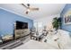 Bright living room featuring modern decor, a plush white sofa, and scenic balcony access at 4516 Seagull Dr # 615, New Port Richey, FL 34652