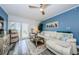 Living room with a comfy white sofa, decorations, and blue accent wall at 4516 Seagull Dr # 615, New Port Richey, FL 34652