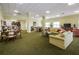 Spacious resident lounge with comfortable seating, tv, kitchenette, and tables at 4516 Seagull Dr # 615, New Port Richey, FL 34652