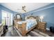 Bedroom with king bed, dresser, nightstands, decor, and a large window for lots of natural light at 4516 Seagull Dr # 615, New Port Richey, FL 34652