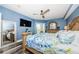 This beautifully decorated main bedroom features wood floors, ceiling fan, and serene ocean view at 4516 Seagull Dr # 615, New Port Richey, FL 34652