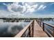 Scenic wooden walkway offering access to waterfront views and boat docks, perfect for scenic strolls at 4516 Seagull Dr # 615, New Port Richey, FL 34652