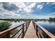 Charming wooden walkway offering access to waterfront views and boat docks, perfect for scenic strolls at 4516 Seagull Dr # 615, New Port Richey, FL 34652