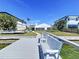 Relaxing waterfront view from the well-maintained dock, complete with built-in bench seating at 5110 W Poe Ave, Tampa, FL 33629