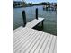 Clean wooden dock with a view of the canal and neighboring residences in this beautiful waterfront community at 5110 W Poe Ave, Tampa, FL 33629