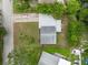 Birds eye aerial of the property showcasing the roof, yard and surrounding area at 5115 32Nd N Ave, St Petersburg, FL 33710