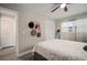 Cozy bedroom with ceiling fan, closet, and window, styled with bags and hats at 5115 32Nd N Ave, St Petersburg, FL 33710