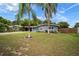 Quaint home featuring a well-kept lawn and striking palm trees that accent the home's curb appeal at 5115 32Nd N Ave, St Petersburg, FL 33710