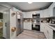 Bright kitchen features stainless steel appliances, white cabinets, and modern gray backsplash at 5115 32Nd N Ave, St Petersburg, FL 33710