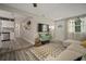 Inviting living room with natural light, new floors, and an open floor plan to the kitchen at 5115 32Nd N Ave, St Petersburg, FL 33710