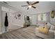 Cozy living room features a ceiling fan, and lots of natural light and new flooring at 5115 32Nd N Ave, St Petersburg, FL 33710
