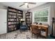 Inviting home office with built-in bookshelves, a ceiling fan, and lots of natural light from the window at 5115 32Nd N Ave, St Petersburg, FL 33710