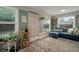 Bright sitting room featuring a comfortable blue sofa and lots of windows at 5115 32Nd N Ave, St Petersburg, FL 33710