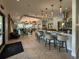 The bar features wood look tile floors, neutral walls, and bar seating at 5313 Windy Grove Dr, Wimauma, FL 33598