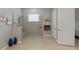 Bright bathroom featuring a glass shower, decor, and a neutral color palette at 5313 Windy Grove Dr, Wimauma, FL 33598